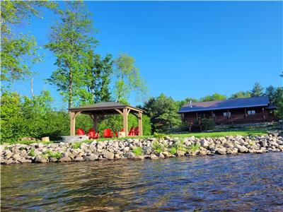 Family oriented waterfront log cabin with new hot tub and Sauna