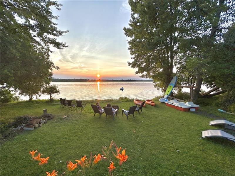 Modern, Sunset Waterfront Cottage with Water Toys & EV Charger