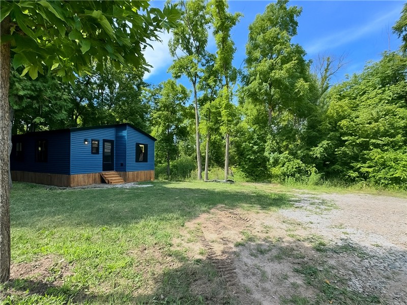 This resort cottage sits on a large nature-filled site and features abundant living space!