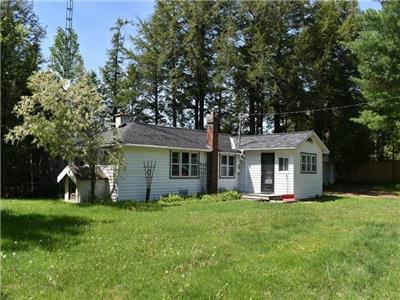 Paudash Lake cottage with west facing sunset views and wood burning fireplace.