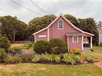 Beach Rose Cottage, situated in historic Victoria by the Sea, 100' from the Northumberland Strait