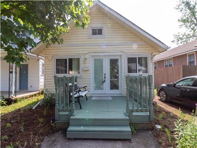 The Secret Garden Cottage - bringing the serenity of nature to your holiday. Steps to Bay Beach.