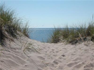 The Sands Cottage - a short walk to the beautiful singing sands beach!