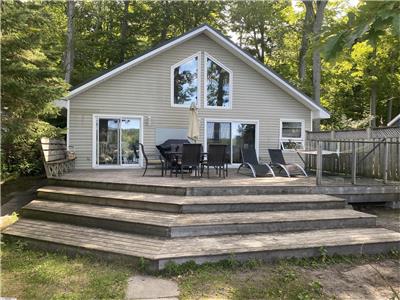 Beautiful Farlain Lake waterfront cottage rental with dock, private, beach and amenities