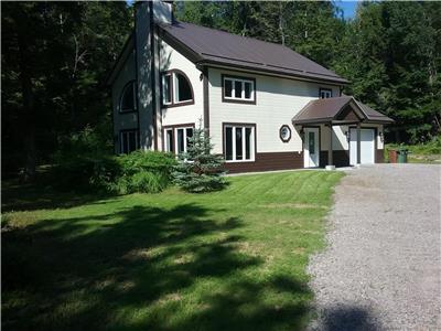cottage near lake du cerf,40 km S-O mt-laurier,year 2008,heated slab,pine wall,2 c.c.,floating dock