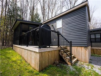 Muskoka Resort Cottage with Rustic Backyard View | Own Today at Shamrock Bay!