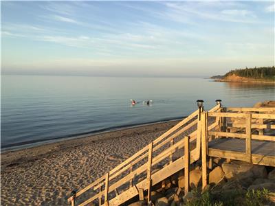 Beach front cottage with guest house and hot tub