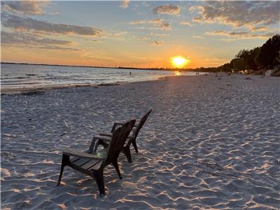 A genuine beach house with stairs to a private sandy beach!