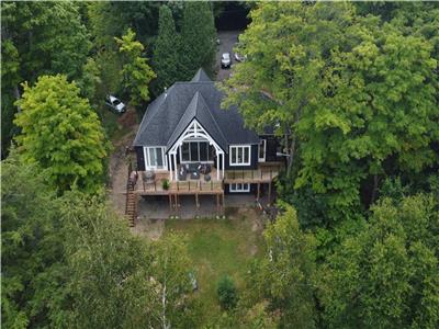 NEW!! Spectacular four season cottage with panoramic, sunset views on prestigious Kennisis Lake!