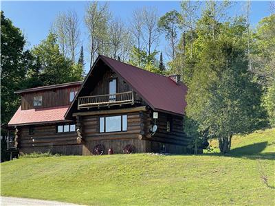 The Farm. Log Home Located on a Farm in Hastings Highlands.