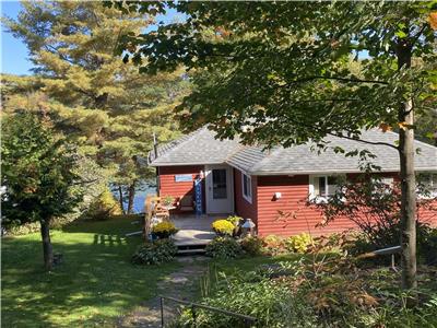 BEAUTIFULLY RENOVATED 4 bdrm, 2 bath COTTAGE (with HOT TUB) on CRYSTAL-CLEAR PRISTINE SKELETON LAKE!