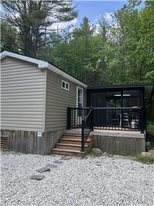 This beautiful unit is located between the trees at Bonnie Lake Resort!
