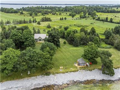 Peaceful private waterfront home with flat water entry on Simcoe Island, Thousand Islands