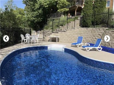 Spacious cottage with a pool and boat dock on the River