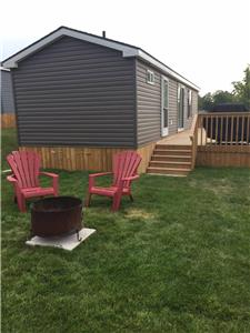 Enjoy this beautifully maintained 2016 Northlander Poplar with a large deck side deck!