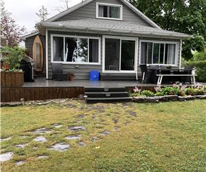 Lakefront Cottage right on beautiful sandy beach.