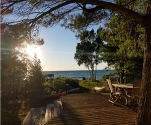 Beautiful West facing Cottage on Beach. Love the white sand and exquisite sunsets. Adore!!