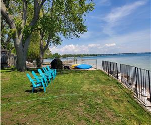"Experience Lakeside Bliss: Relax in a Hot Tub and Roast Marshmallows by the Firepit"