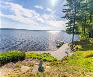 THANKSGIVING AVAILABLE! LAKEFRONT SERENITY ON COVETED ROUND LAKE!! 170' SHORELINE! 2.5 ACRES