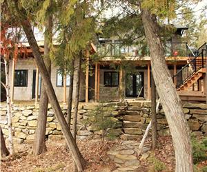 Stunning cottage on sand beach on prestigious Kennisis Lake!
