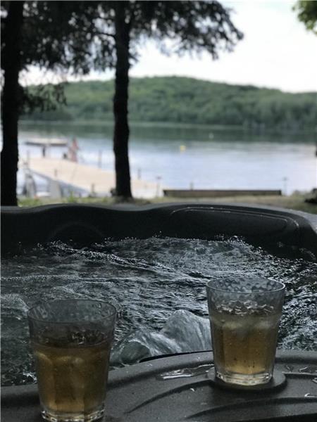 Book your fall vacation soon! Enjoy the hot tub by the lake with beautiful fall colors!